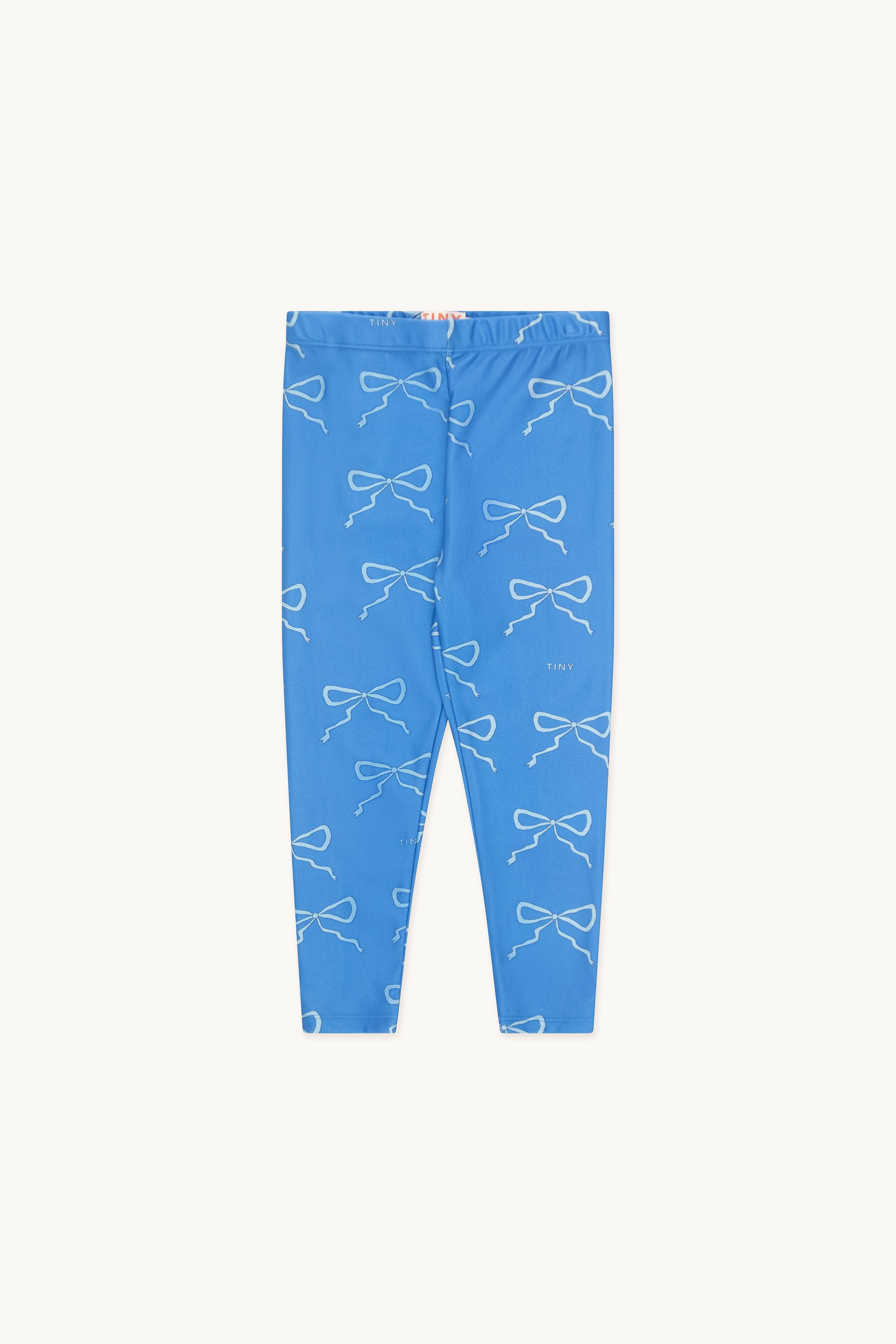 Legging pour enfant bleu brillant avec un motif de boucle blanc sur l'ensemble.