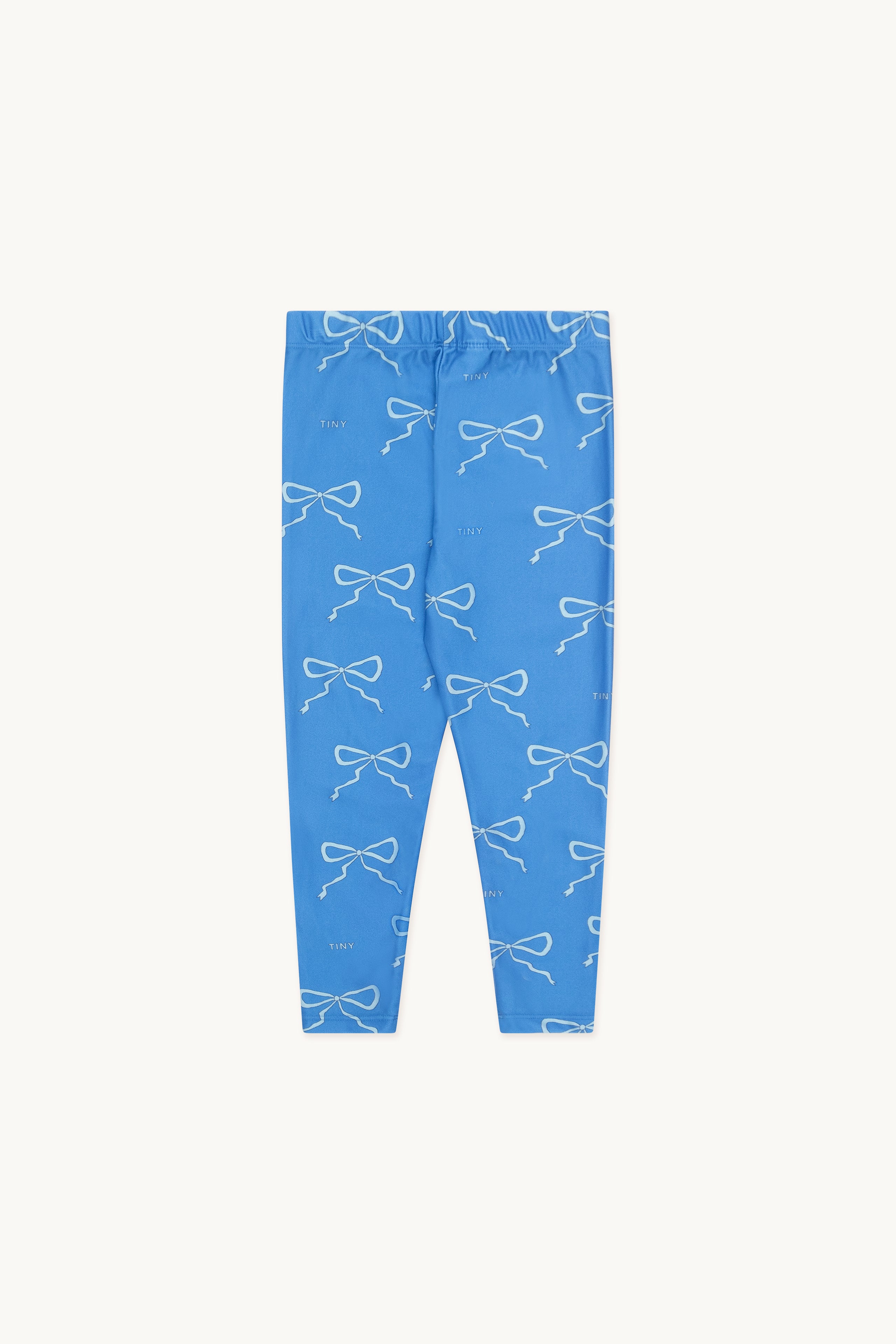 Legging pour enfant bleu brillant avec un motif de boucle blanc sur l'ensemble.