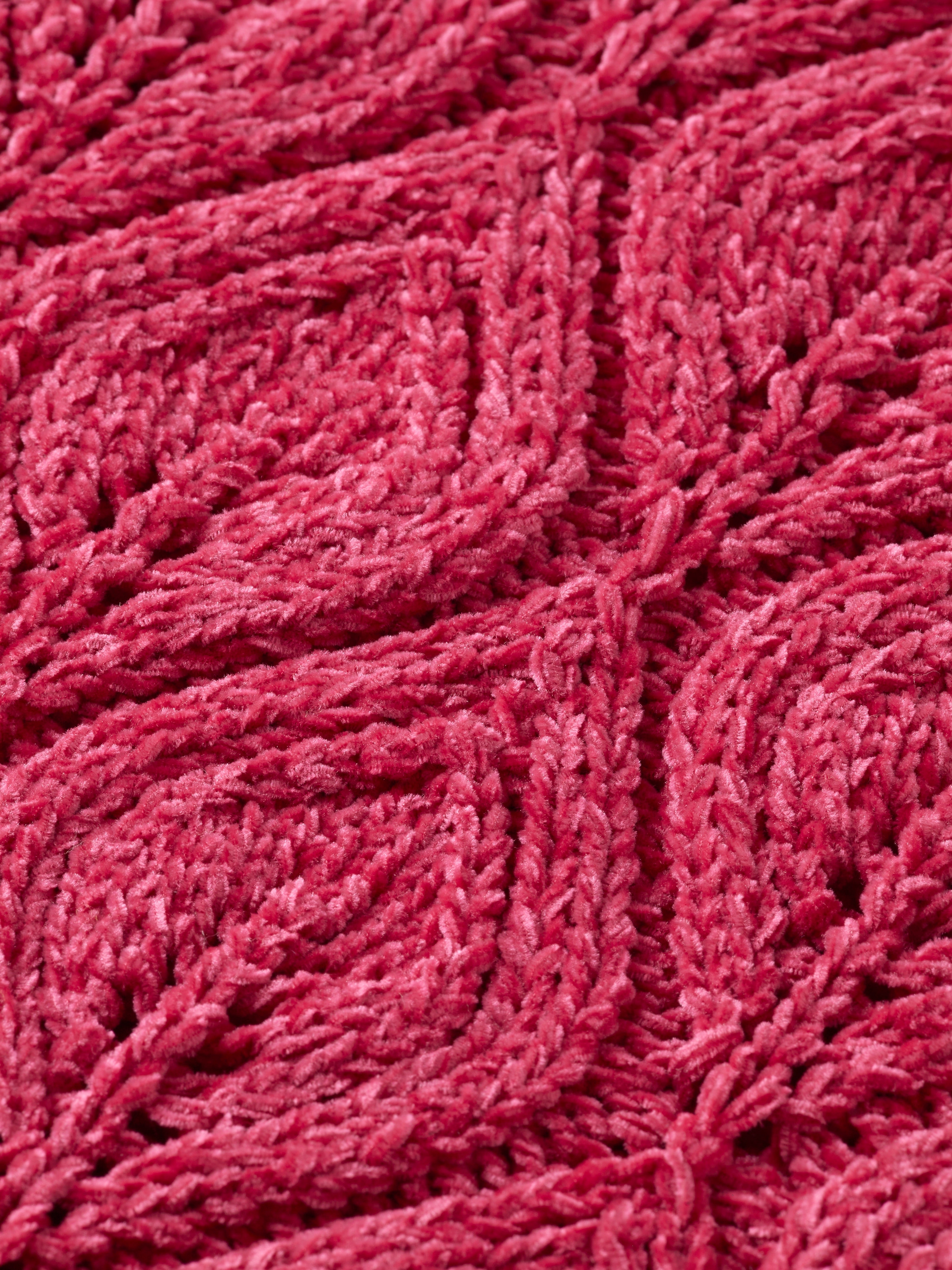 Texture de tricot en velours rose.