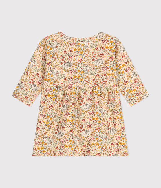 Une robe pour bébé à col rond, couleur crème et motif de petites fleurs colorées.