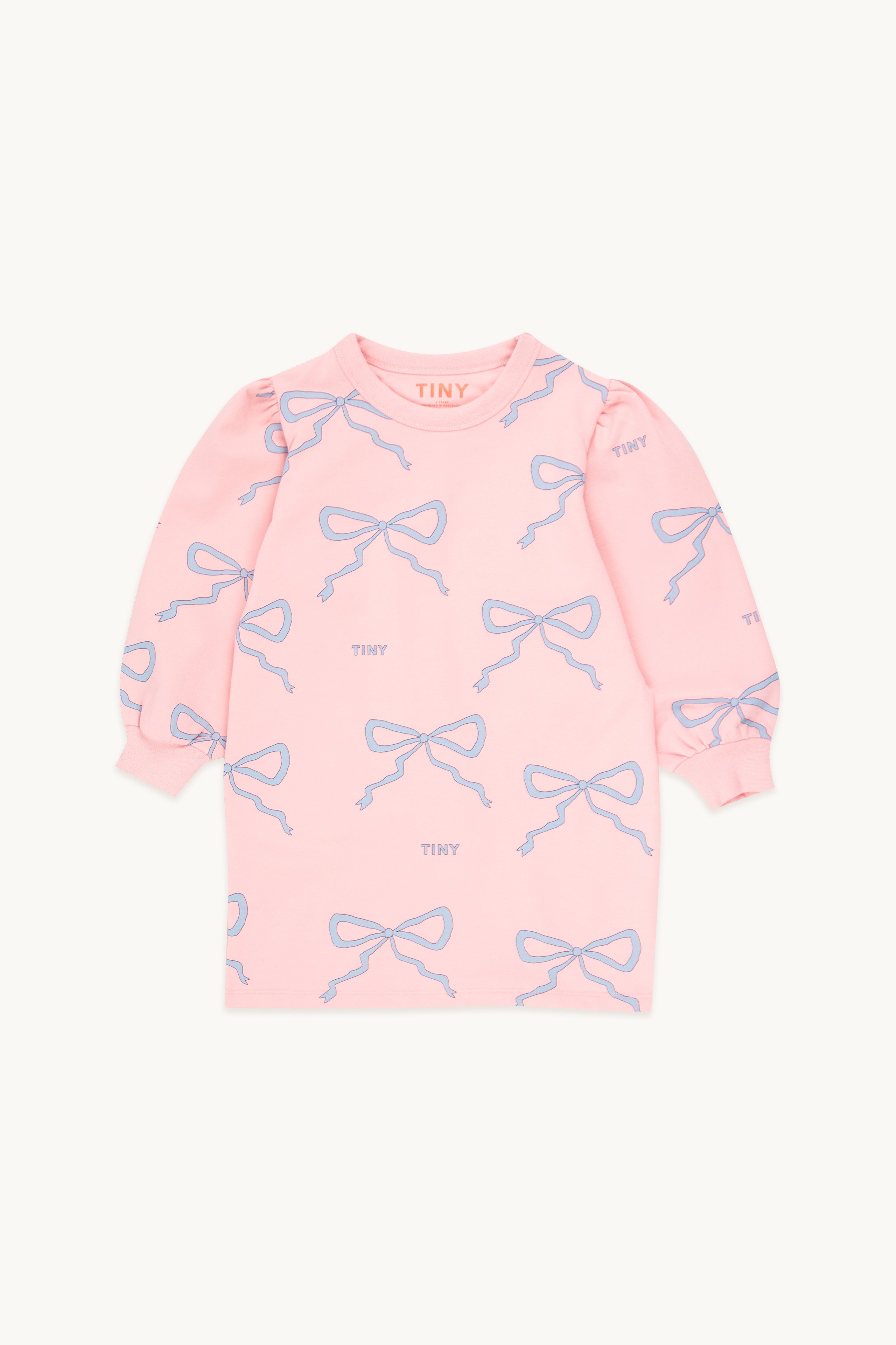 Robe pour enfants rose à manches longue, avec motif de boucle bleu.