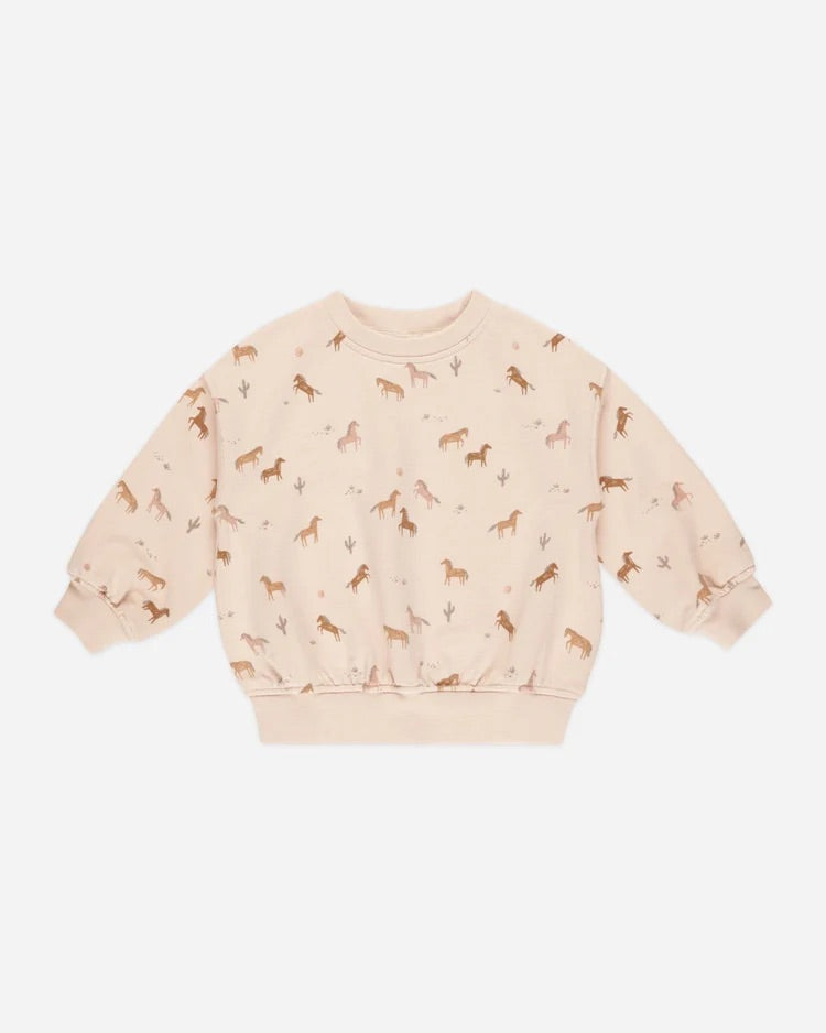 Sweatshirt rose à motif de chevaux.