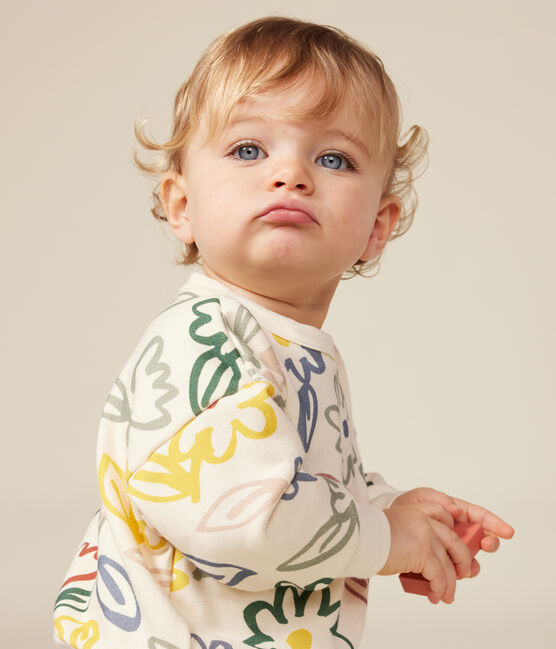 Un sweatshirt pour bébé beige avec un motif de fleurs dessinées colorées.