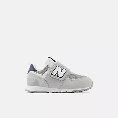 Chaussure New Balance 574 grise pour bébé/tout-petit avec bande auto-agrippante et logo N bleu marine