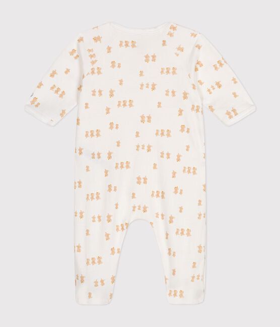 Un pyjama pour bébé une pièce blanc, avec motif d'illustration de poussins jaunes.