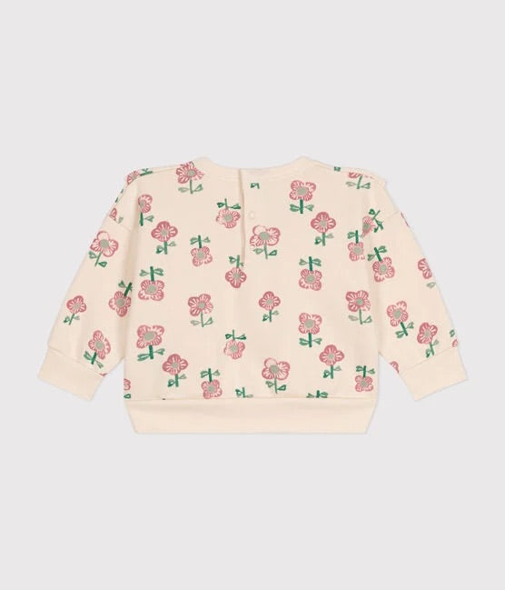 Un sweatshirt beige à motif imprimé de roses.