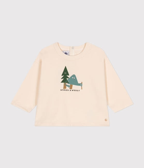 Un t-shirt beige avec illustration d'arbres avec des yeux.