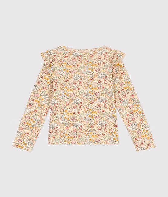 Un t-shirt à manches fleuri jeune, blanc et rouge, avec des volants sur les épaules.